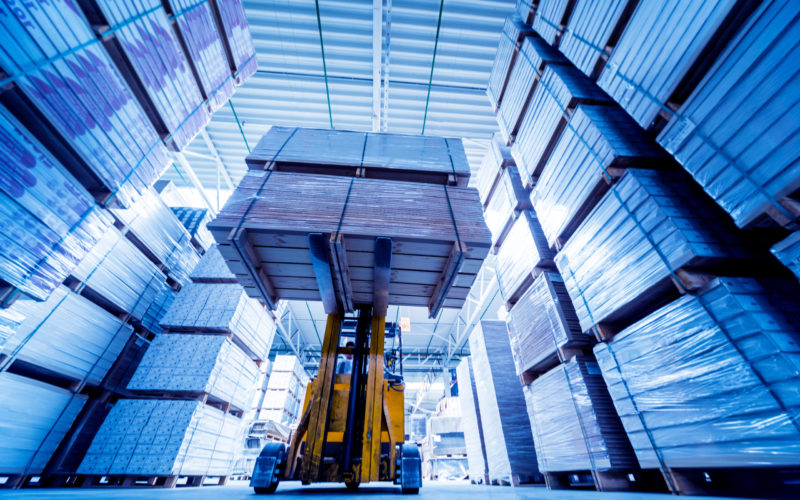 Forklift loader in storage warehouse ship yard. Distribution products. Delivery. Logistics. Transportation. Business background