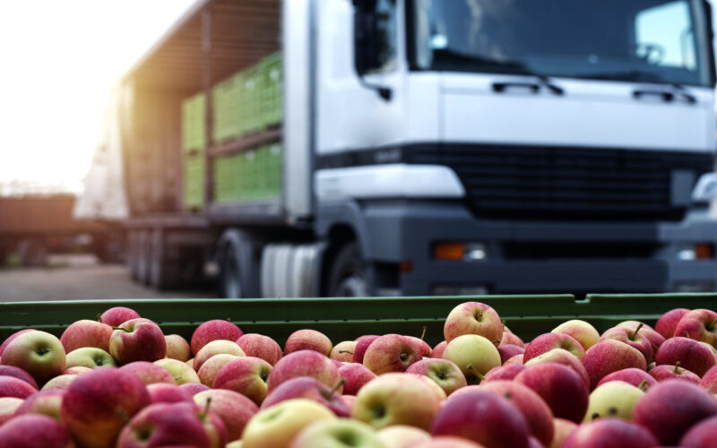 Fruit and food distribution. Truck loaded with containers full o