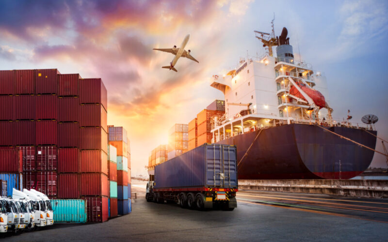 Container truck in ship port for business Logistics and transportation of Container Cargo ship and Cargo plane with working crane bridge in shipyard at sunrise, logistic import export and transport industry background